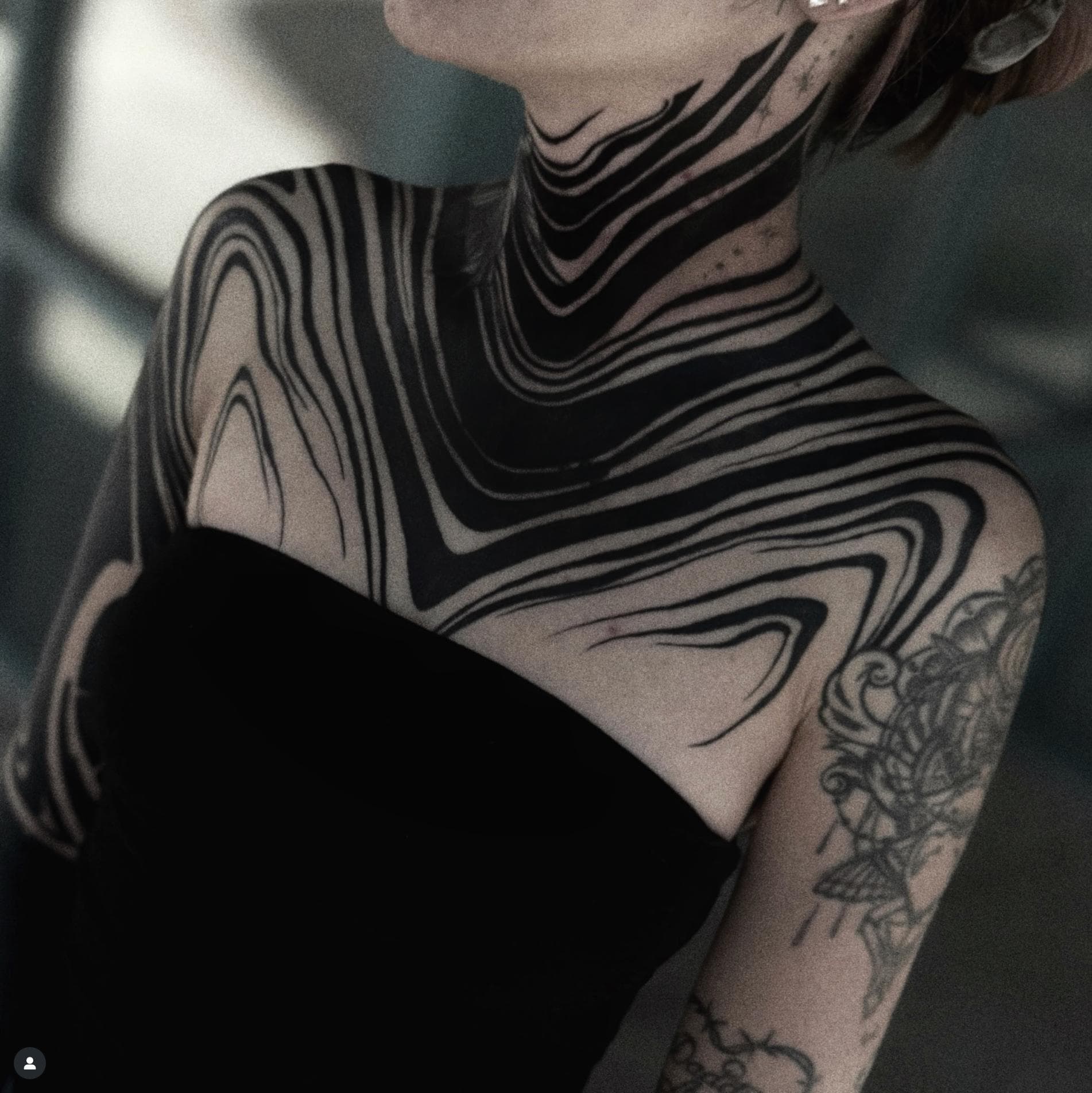 Blackwork abstract pattern tattoo on neck and shoulders